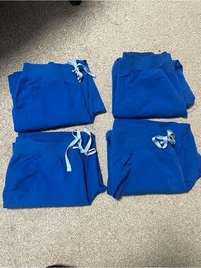 4 Pairs of Figs, Kade Cargo Royal Blue Scrub Pants.
All sized Medium Petite
